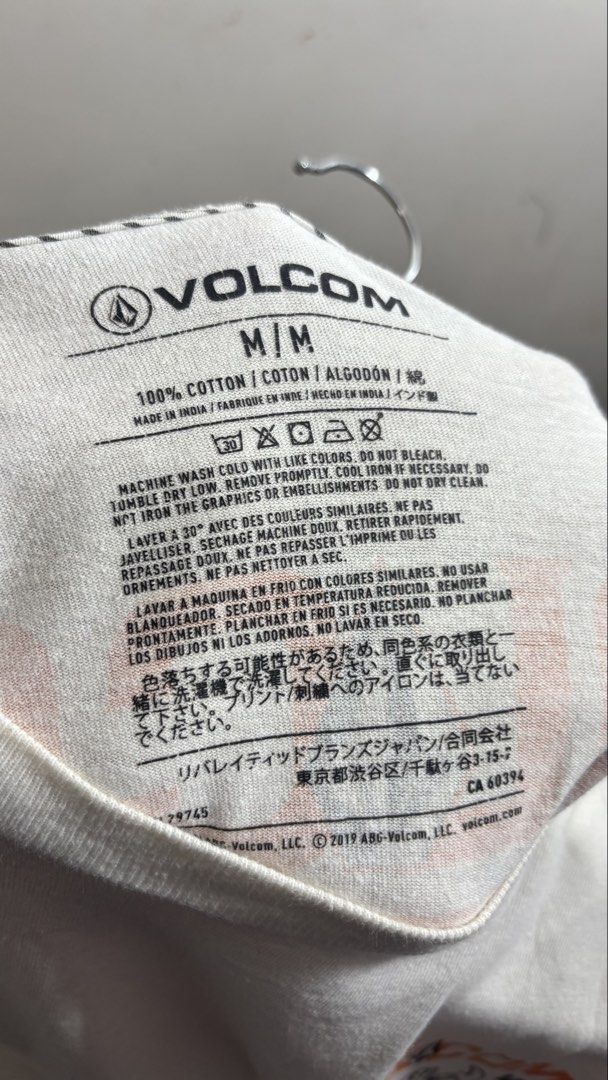 Volcom Work Wear Stone Co T-Shirt White M (Category: Tshirts & Polo Shirts ) located in Manila. Submitted by adaalea_14 (Listing ID 1465742983, Image 3). Description: - Brand/Model: Volcom Work Wear Stone Co Graphic T-Shirt - Color: White - Size: Medium (M) - Material: 100% Cotton (Made in India) - Design: Small hammer & fist chest print, large matching back graphic - Condition: Good overall, with a small hole near the bottom back graphic - Care: