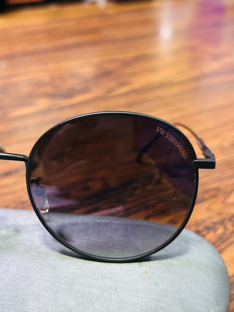 VW Vera Wang Round Black Sunglasses (Category: Sunglasses & Eyewear) located in Manila. Submitted by starbalesukandjapansurplus (Listing ID 1465746818, Image 3). Description: - Brand: VW Vera Wang - Frame: Minimalist matte black metal with adjustable nose pads - Lenses: Round gradient, clear branding on right lens corner - Condition: Clean, no scratches on glass - Style: Great daily shades.