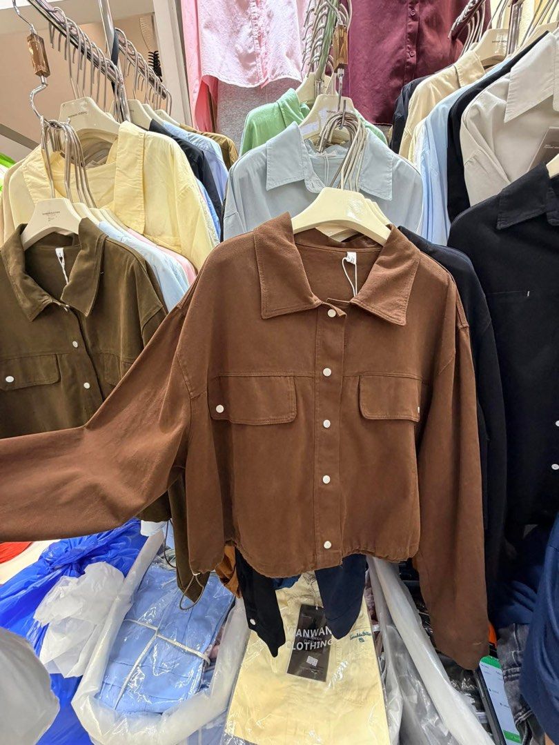Wanwan Clothing Brown Crop Jacket with Drawstring (Category: Coats, Jackets and Outerwear) located in Silang. Submitted by collectionbyrk (Listing ID 1465517736, Image 1). Description: - Brand: Wanwan Clothing - Color: Deep chocolate brown - Style: Casual streetwear crop jacket - Features: Long sleeves, pointed collar, front button closure, and dual chest flap pockets - Fit: Adjustable drawstring hem on both sides - Condition: Brand new with orig