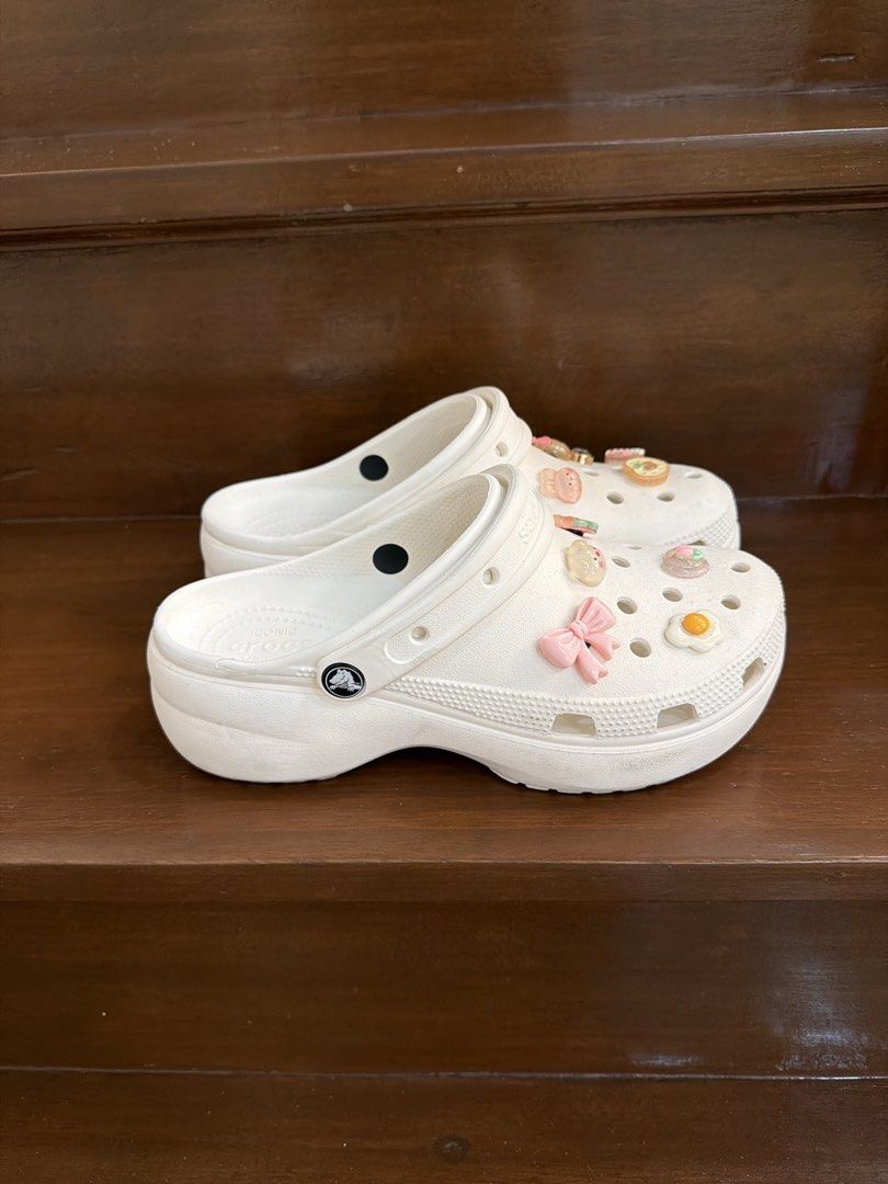 White Crocs Classic Clog Platform with Jibbitz charms (Category: Slippers and slides) located in San Juan City. Submitted by hazeldee (Listing ID 1465718158, Image 3). Description: - Color/Style: White platform classic clog - Inclusions: Comes with cute Jibbitz charms (fried egg, pink bow, bear, and food items) - Features: Slip-on design with pivoting heel straps & Iconic Crocs Comfort footbed - Condition: Excellent 100% Authentic with Crocs Offi