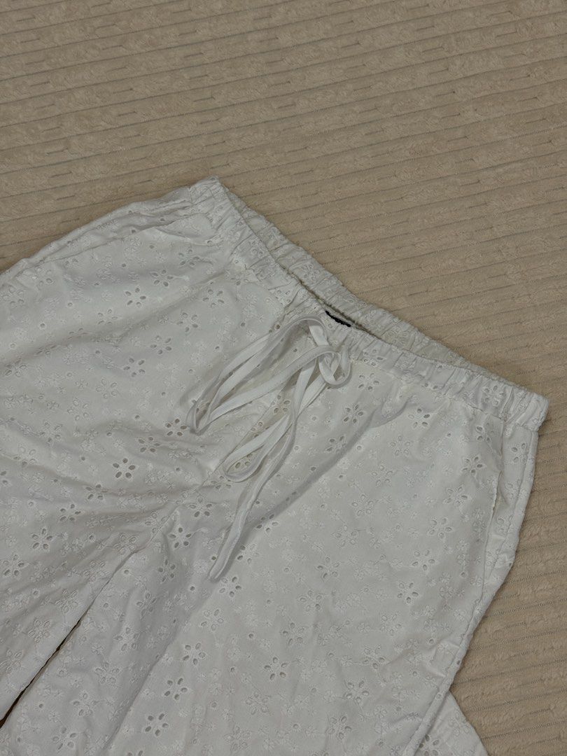 White Eyelet Embroidered Drawstring Lounge Pants (Category: Joggers) located in Manila. Submitted by notmakidee (Listing ID 1465597491, Image 2). Description: — already lined but still a bit see through — worn once size: 25”-27” (length: 40”) loc: Bohol but can ship nationwide via j&t @wornbymaki on IG.