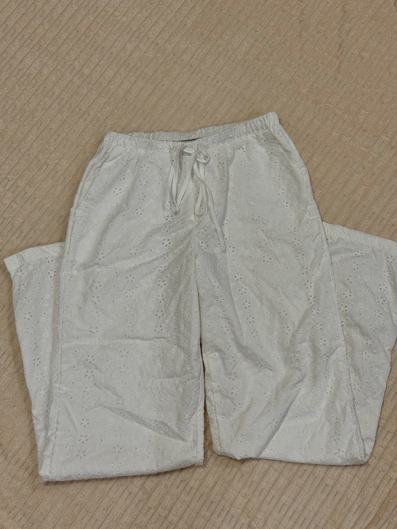White Eyelet Embroidered Drawstring Lounge Pants (Category: Joggers) located in Manila. Submitted by notmakidee (Listing ID 1465597491, Image 1). Description: — already lined but still a bit see through — worn once size: 25”-27” (length: 40”) loc: Bohol but can ship nationwide via j&t @wornbymaki on IG.