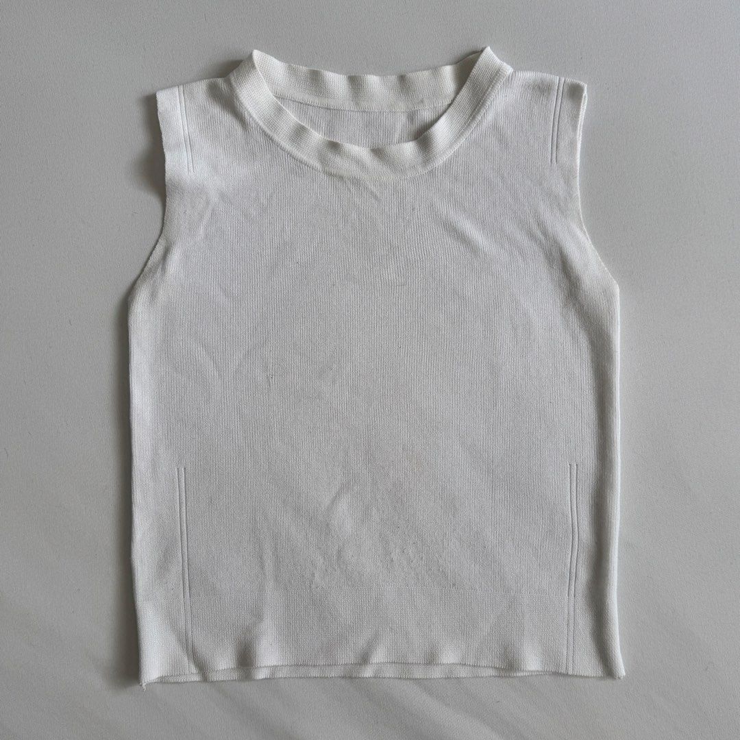 White Knit Tank Top (Category: Sleeveless) located in Antipolo. Submitted by bingomama (Listing ID 1465591586, Image 1). Description: White sleeveless knit top with a ribbed texture. Round neckline, simple basic style. Lightweight material, easy to match with jeans or skirts. - Has some signs of usage and pilling, but still in good condition - fits size S, stretchy material Measurements: Length: 17” Chest: 13.5” 📍Marikina City For meet up McDo R