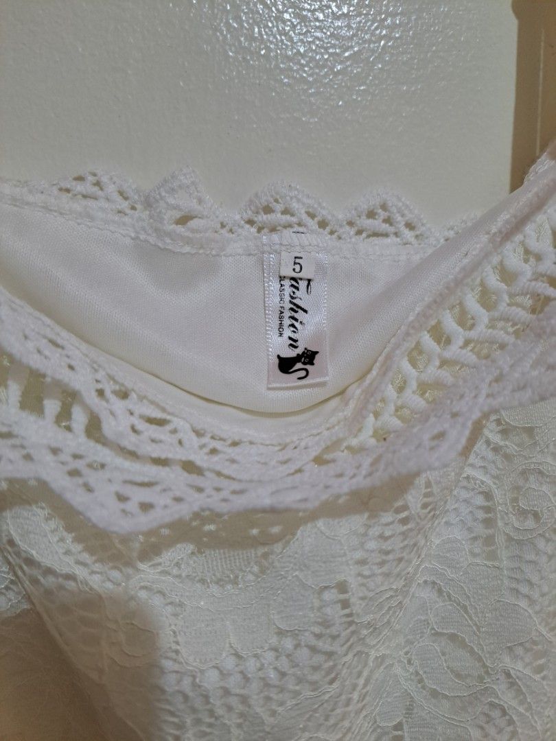 White Lace Off Shoulder Dress (Category: Dresses) located in Manila. Submitted by yselles__ (Listing ID 1465603223, Image 2). Description: - Style: Off-shoulder white lace dress with short sleeves - Comfort: Fully lined with a soft white inner layer - Condition: Great overall shape - Perfect for: Summer or casual outings.