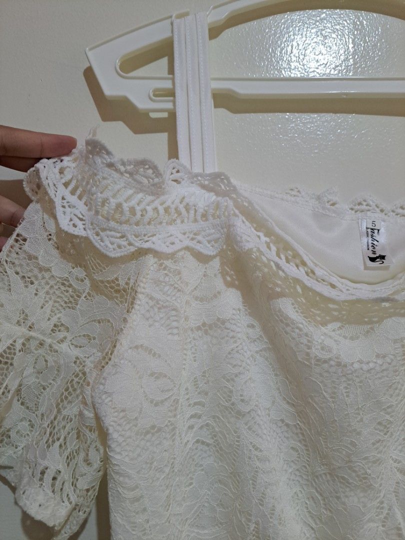 White Lace Off Shoulder Dress (Category: Dresses) located in Manila. Submitted by yselles__ (Listing ID 1465603223, Image 3). Description: - Style: Off-shoulder white lace dress with short sleeves - Comfort: Fully lined with a soft white inner layer - Condition: Great overall shape - Perfect for: Summer or casual outings.
