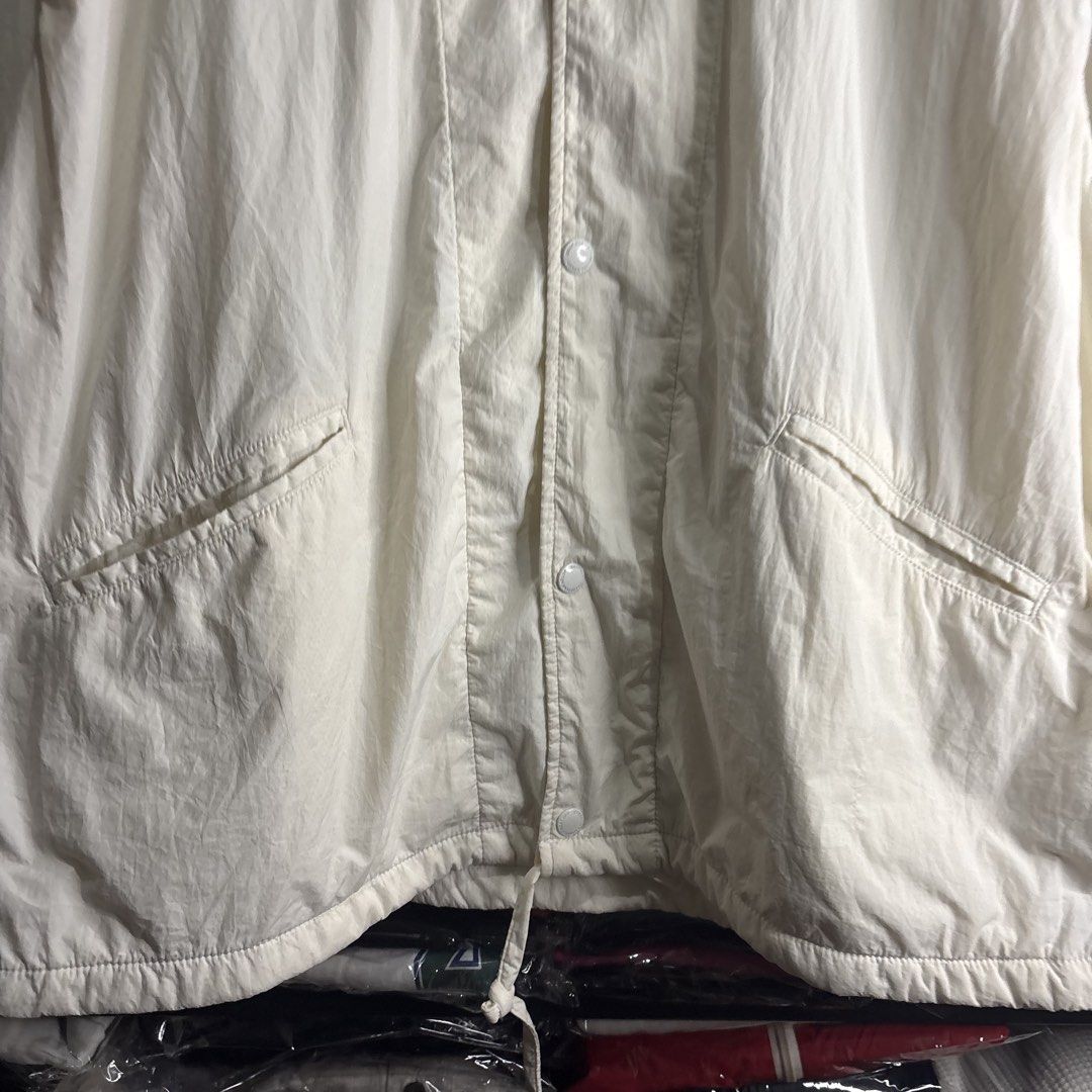 White Lightweight Windbreaker Jacket Size L (Category: Coats, Jackets and Outerwear) located in Cavite. Submitted by goodstayojan.cvt (Listing ID 1465720322, Image 2). Description: Random Comfy White Puffer Jacket L on tag(25 x 28 x 22sleeves) Verygood Condition No flaws! - Size: Large - Color: White - Material: Lightweight, breathable with inner mesh lining - Closure: Front buttons - Pockets: Two slanted front pockets - Fit: Adjustable drawstrin