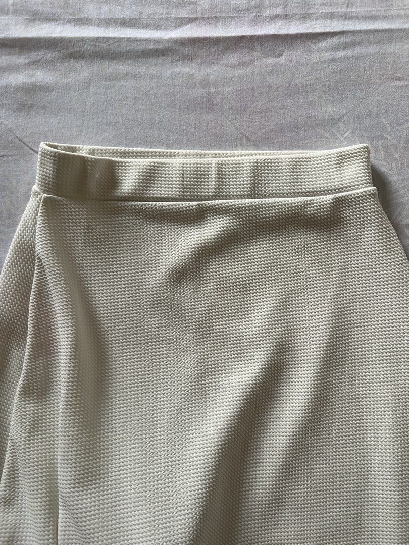 White Midi Skirt with Side Split Waffle Knit Fabric (Category: Skirts) located in Quezon City. Submitted by katedeclutter (Listing ID 1465601689, Image 3). Description: - Color: Cream / Off-white (neutral and versatile) - Fabric: Textured waffle knit.