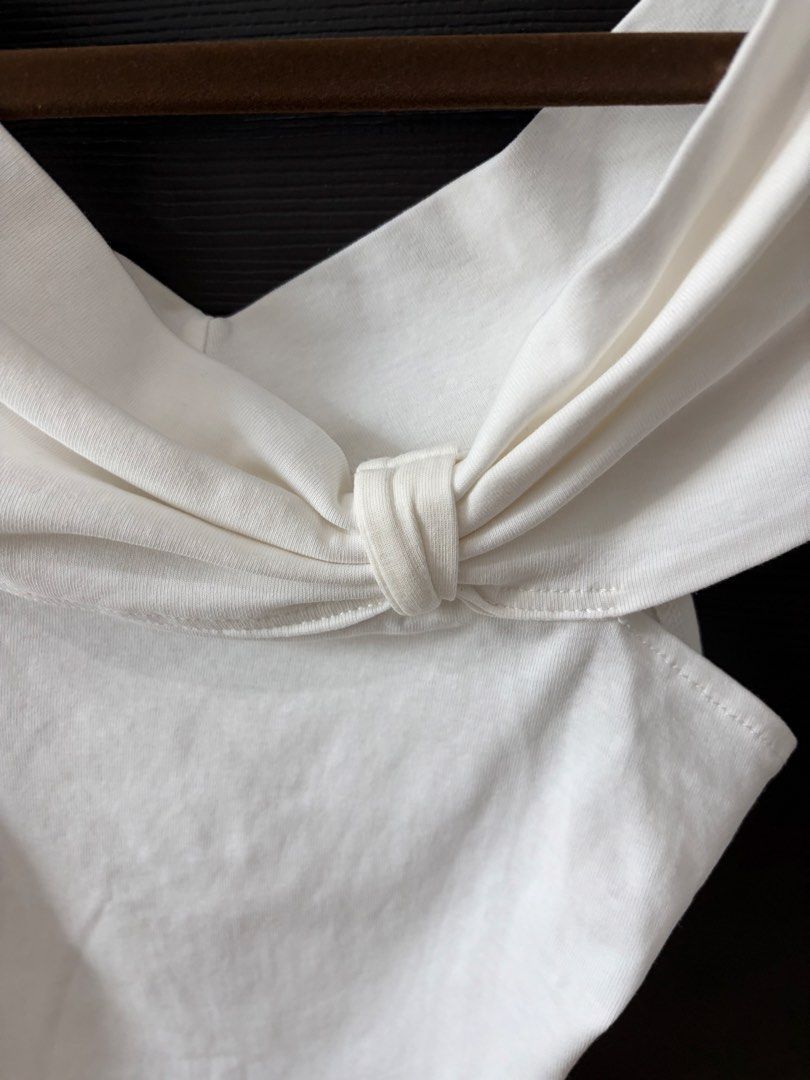White off-shoulder top with front knot detail (Category: Blouses) located in Paranaque City. Submitted by mary_jj (Listing ID 1465655596, Image 2). Description: fits xs-m.