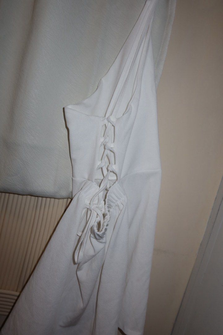 White One-Shoulder Lace-Up Side Romper (Category: Rompers) located in Cavite. Submitted by mcjkim (Listing ID 1465705848, Image 3). Description: - Size: Freesize but Fits Small to Medium Frame - Condition: Like New, only worn ONCE - Style: Chic white one-shoulder romper with fitted shorts - Details: Eye-catching lace-up side with a gathered hip tie - Fit: Fitted bodice with slight stretch for comfort - Perfect for: Summer outings, parties, and OO