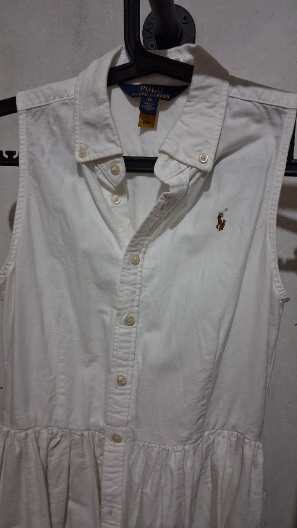 White Sleeveless Dress (Category: Dresses) located in Manila. Submitted by boldfish_512666 (Listing ID 1465743976, Image 2). Description: - Style: White sleeveless collared dress with front button closure - Size: 14 - Condition: Excellent pre-loved condition (ready to wear!).