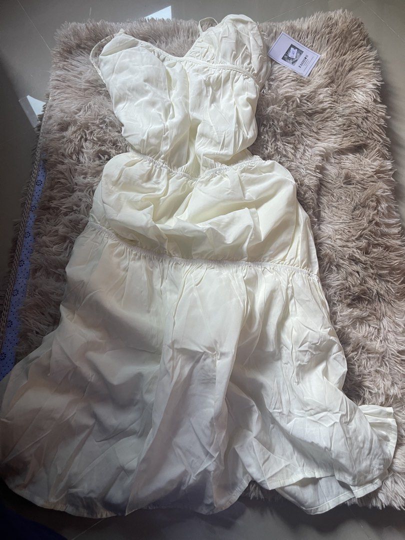 White Spaghetti Strap Tiered Ruffle Dress (Category: Dresses) located in Manila. Submitted by reinheart13 (Listing ID 1465683629, Image 3). Description: - Style: White midi dress with spaghetti straps - Fit: Elasticated waistband with a multi-tiered flowy skirt - Details: Gathered detailing and soft fabric - Condition: Brand new with original tags attached - Perfect for: Weekend brunch or casual day outs -With inner lining NO RETURN/REFUND PAMPAN