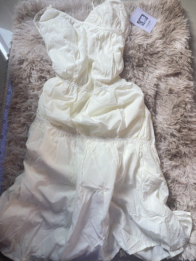 White Spaghetti Strap Tiered Ruffle Dress (Category: Dresses) located in Manila. Submitted by reinheart13 (Listing ID 1465683629, Image 1). Description: - Style: White midi dress with spaghetti straps - Fit: Elasticated waistband with a multi-tiered flowy skirt - Details: Gathered detailing and soft fabric - Condition: Brand new with original tags attached - Perfect for: Weekend brunch or casual day outs -With inner lining NO RETURN/REFUND PAMPAN