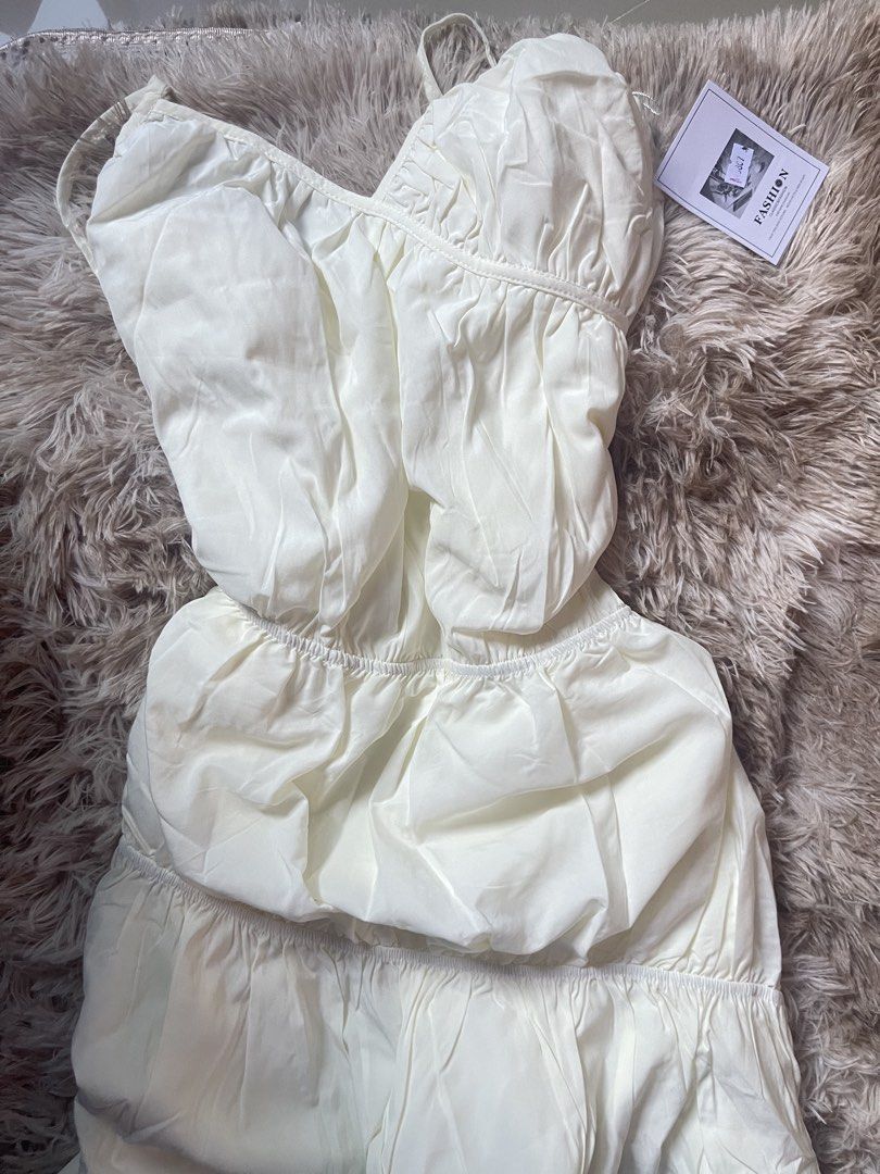 White Spaghetti Strap Tiered Ruffle Dress (Category: Dresses) located in Manila. Submitted by reinheart13 (Listing ID 1465683629, Image 2). Description: - Style: White midi dress with spaghetti straps - Fit: Elasticated waistband with a multi-tiered flowy skirt - Details: Gathered detailing and soft fabric - Condition: Brand new with original tags attached - Perfect for: Weekend brunch or casual day outs -With inner lining NO RETURN/REFUND PAMPAN