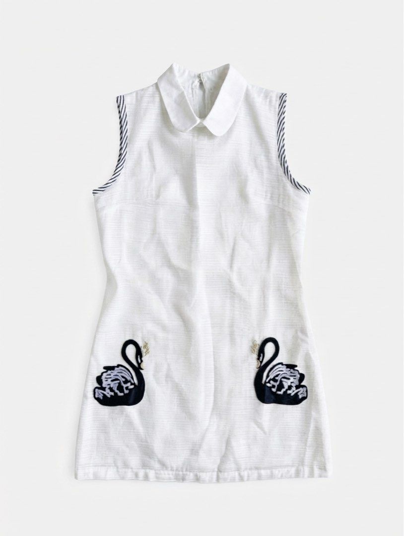 White Swan Embroidered Peter Pan Collar Top (Category: Dresses) located in Vigan. Submitted by margaux.archive (Listing ID 1465728738, Image 2). Description: A crisp white sleeveless top with delicate swan embroidery and subtle striped trim. Feminine, playful, and easy to style. Quietly charming, effortlessly polished..