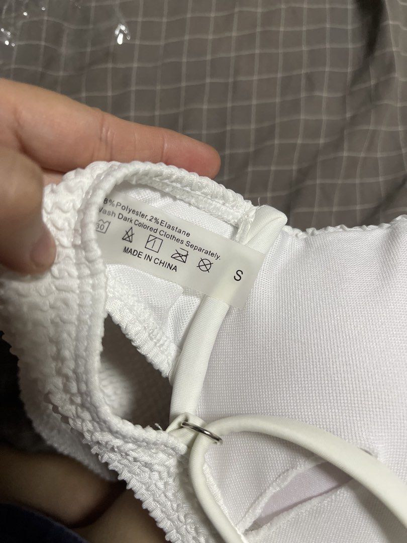 White textured crinkle bikini set two-piece swimsuit (Category: Bikinis & Swimsuits) located in Calamba. Submitted by goldenprngs101 (Listing ID 1465688736, Image 2). Description: - Style: Two-piece bikini - Color: White with trendy crinkle texture - Size: Small, 32A - Top: Underwire support, adjustable shoulder straps, and back clasp closure - Bottoms: Flattering high-leg cut - Material: Polyester and elastane - Condition: Clean, excellent, and 