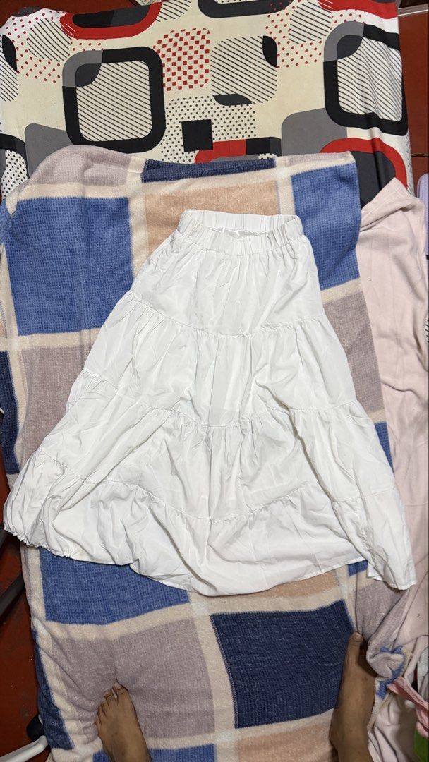 White Tiered Maxi Skirt (Category: Skirts) located in Quezon City. Submitted by e182885da6246a5b75aac67add07a3 (Listing ID 1465629245, Image 2). Description: - Color: Classic White - Design: Tiered with multiple layered ruffles - Waistband: Comfortable elastic waistband, pull-on style - Fabric: Lightweight and breathable - Styling: Pairs easily with casual tees and blouses.