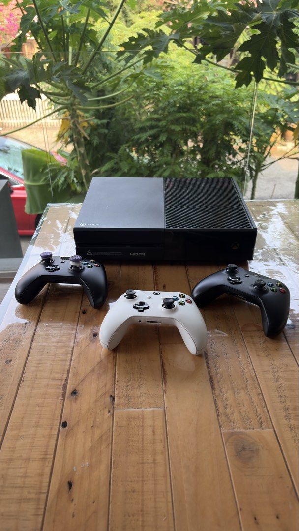 Xbox One Console (Category: Xbox) located in Singapore. Submitted by utoppia (Listing ID 1465660321, Image 1). Description: - Platform: Original Xbox One Console (Black) - Condition: Fully tested, 100% working, and ready for gaming - Controllers: 2 controllers included - comes with power cable and hdmi cable -the pairing button on the console might not work.