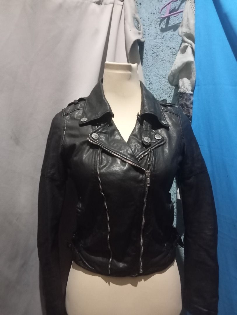 Y2K Black Leather Biker Jacket XS-S (Category: Coats, Jackets and Outerwear) located in Balanga. Submitted by elle.armoire (Listing ID 1465711551, Image 1). Description: - Size: XS (Short cropped fit) - Details: Asymmetric zip front, lapels with metallic studs, and buckle straps on cuffs - Interior: Stylish striped inner lining - Style: Edgy, rock-inspired look .