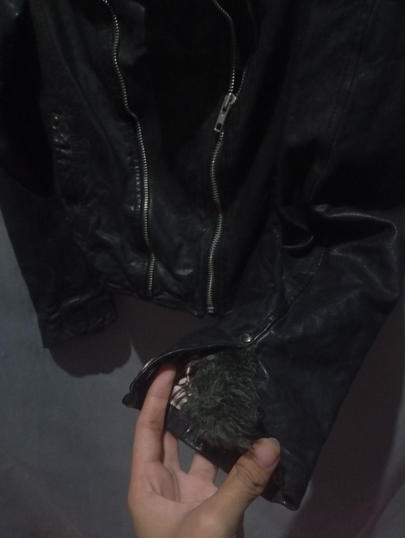 Y2K Black Leather Biker Jacket XS-S (Category: Coats, Jackets and Outerwear) located in Balanga. Submitted by elle.armoire (Listing ID 1465711551, Image 3). Description: - Size: XS (Short cropped fit) - Details: Asymmetric zip front, lapels with metallic studs, and buckle straps on cuffs - Interior: Stylish striped inner lining - Style: Edgy, rock-inspired look .
