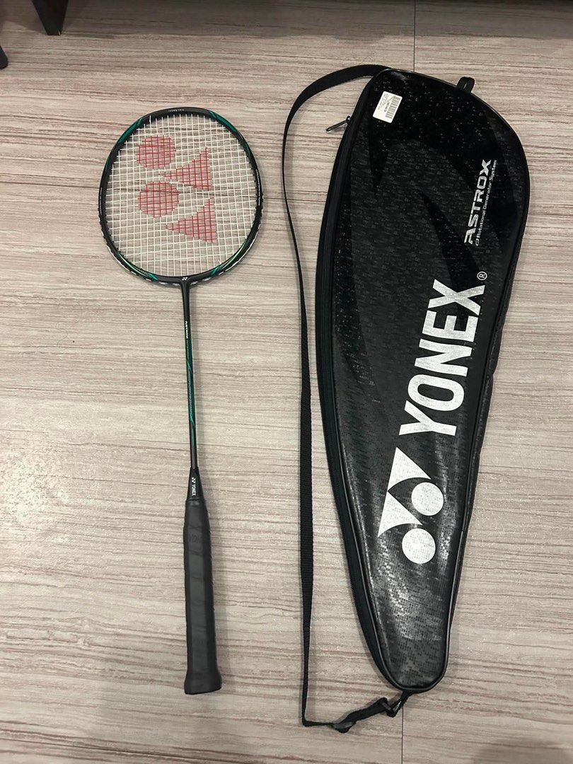 Yonex Astrox Nextage Badminton Racket with Cover (Category: Racket and Ball Sports) located in Manila. Submitted by lhynthea (Listing ID 1465695233, Image 1). Description: - Model: Yonex Astrox Nextage Badminton Racket - Color: Black and green - Inclusions: Matching Yonex Astrox carrying bag with strap - Grip: Standard grip size with Yonex logo butt cap - Condition: Strung and ready for play - Ideal for: Great setup for regular court sessions.