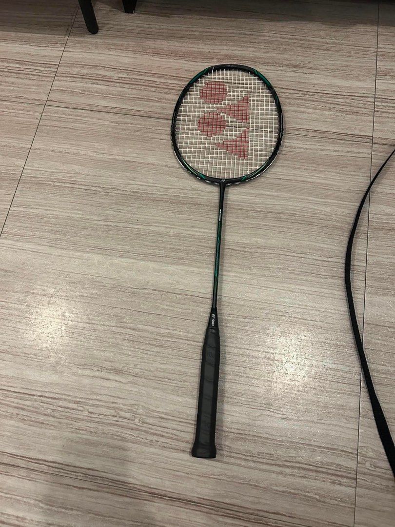 Yonex Astrox Nextage Badminton Racket with Cover (Category: Racket and Ball Sports) located in Manila. Submitted by lhynthea (Listing ID 1465695233, Image 2). Description: - Model: Yonex Astrox Nextage Badminton Racket - Color: Black and green - Inclusions: Matching Yonex Astrox carrying bag with strap - Grip: Standard grip size with Yonex logo butt cap - Condition: Strung and ready for play - Ideal for: Great setup for regular court sessions.