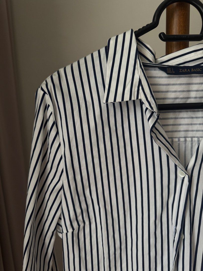 Zara Basic Black and White Striped Long Sleeve Button-Down Shirt (Category: Longsleeves) located in Pasig City. Submitted by kutleyn (Listing ID 1465670609, Image 3). Description: - Brand: Zara Basic - Style: Classic black and white vertical striped button-down shirt - Size: L (EUR L, USA L, MEX 30) but fits S-M - Features: Long sleeves with button cuffs, classic collar, front button placket - Versatility: Perfect for work, smart-casual, or every