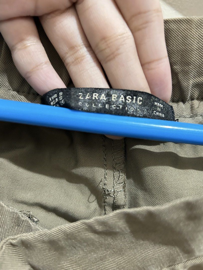 Zara Basic Brown Trousers Size S (Category: Jeans) located in Manila. Submitted by frances_001 (Listing ID 1465692373, Image 3). Description: - Brand: Zara Basic Collection - Size: S - Color: Brown - Fit: High waist with front pleats and cuffed hems - Closure: Front zipper and button - Condition: Worn a few times, still in great shape - Style tip: Easy to pair with sneakers or loafers for an effortless everyday look.