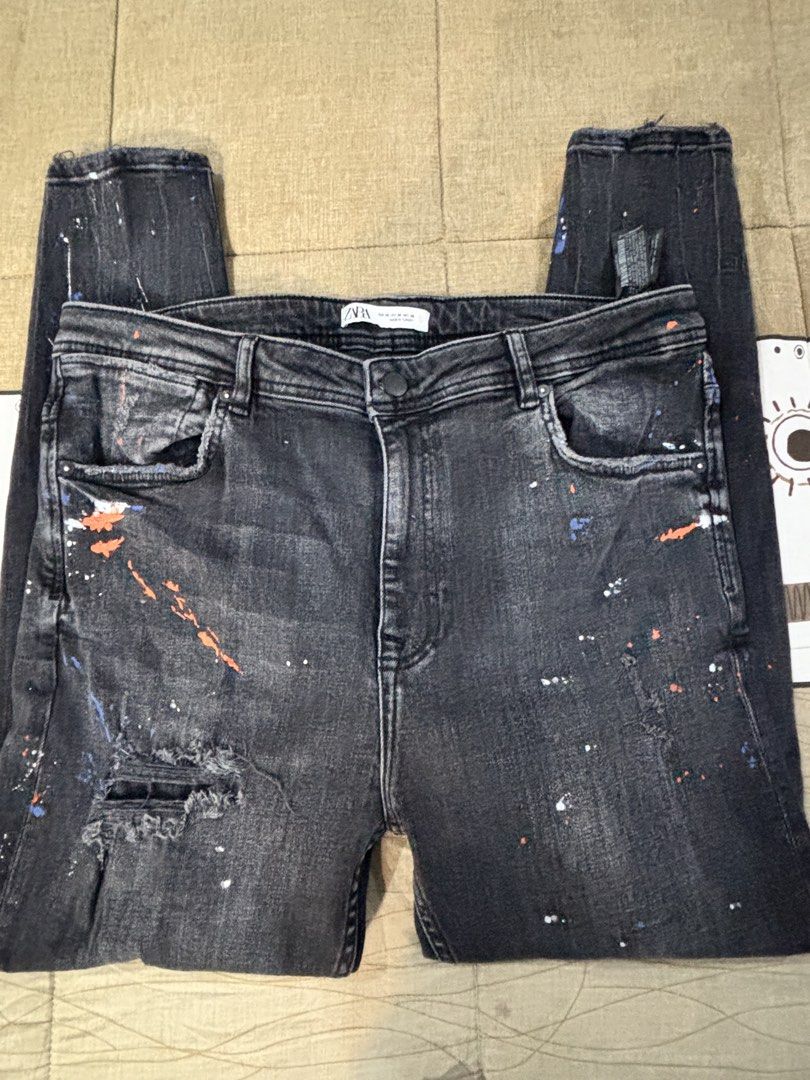 Zara Black Paint Splatter Distressed Jeans (Category: Jeans) located in Paranaque City. Submitted by antzsome (Listing ID 1465595640, Image 1). Description: - Brand: Zara - Color: Washed black - Details: Distressed knee & orange/white blue paint splatter effect - Condition: Excellent / Ready to wear 2k 09177011079.