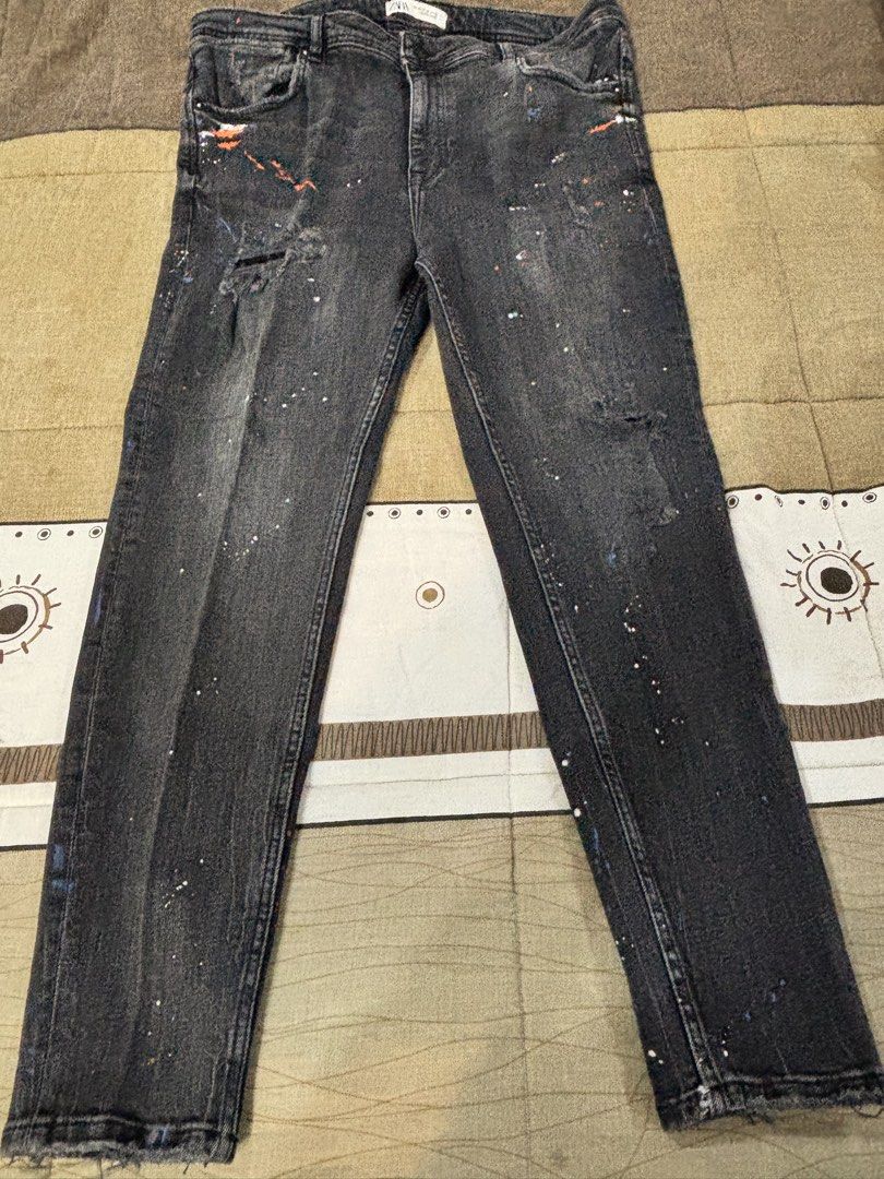 Zara Black Paint Splatter Distressed Jeans (Category: Jeans) located in Paranaque City. Submitted by antzsome (Listing ID 1465595640, Image 3). Description: - Brand: Zara - Color: Washed black - Details: Distressed knee & orange/white blue paint splatter effect - Condition: Excellent / Ready to wear 2k 09177011079.