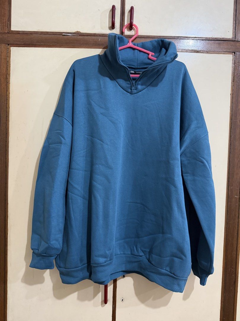 Zara Blue Quarter Zip Sweatshirt (Category: Coats, Jackets and Outerwear) located in Manila. Submitted by preloved_new_forsale (Listing ID 1465635858, Image 1). Description: - Brand: Zara - Style: Quarter zip sweatshirt - Color: Blue - Size: Medium (Oversized fit) - Features: High collar, front zipper, soft fleece lining - Details: Ribbed cuffs and hem - Origin: Made in Pakistan.