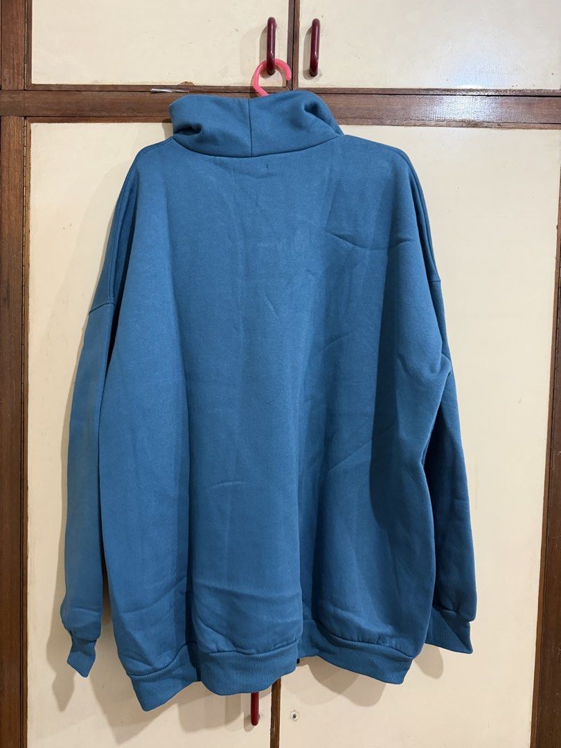 Zara Blue Quarter Zip Sweatshirt (Category: Coats, Jackets and Outerwear) located in Manila. Submitted by preloved_new_forsale (Listing ID 1465635858, Image 2). Description: - Brand: Zara - Style: Quarter zip sweatshirt - Color: Blue - Size: Medium (Oversized fit) - Features: High collar, front zipper, soft fleece lining - Details: Ribbed cuffs and hem - Origin: Made in Pakistan.