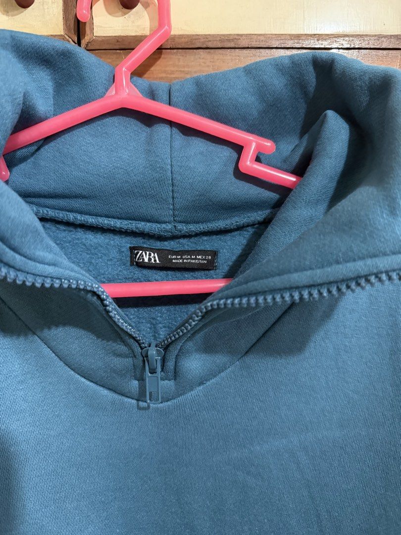Zara Blue Quarter Zip Sweatshirt (Category: Coats, Jackets and Outerwear) located in Manila. Submitted by preloved_new_forsale (Listing ID 1465635858, Image 3). Description: - Brand: Zara - Style: Quarter zip sweatshirt - Color: Blue - Size: Medium (Oversized fit) - Features: High collar, front zipper, soft fleece lining - Details: Ribbed cuffs and hem - Origin: Made in Pakistan.