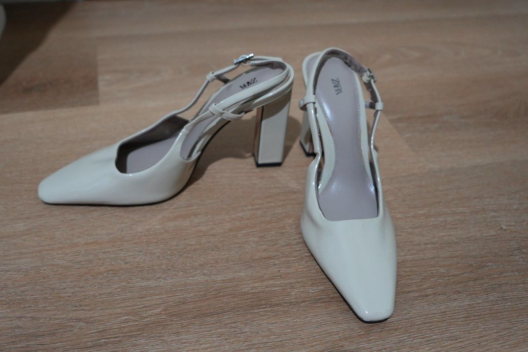 Zara Cream Slingback Heels Size 37 (Category: Heels) located in Cainta. Submitted by karsssss (Listing ID 1465756927, Image 2). Description: - Brand: Zara - Style: Patent slingback heels with square toe and block heel - Color: Cream - Size: 37 - Closure: Adjustable ankle strap with buckle .