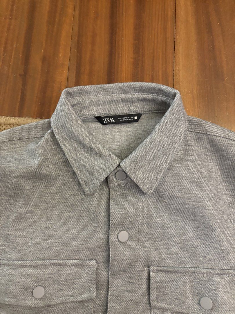 Zara Grey Button-Up Jacket Size S (Category: Coats, Jackets and Outerwear) located in Paranaque City. Submitted by max_bully014 (Listing ID 1465609545, Image 2). Description: - Brand: Zara - Size: S - Color: Neutral solid grey - Origin: Made in Turkey - Features: Structured collar, front button closure, two button-flap chest pockets, long sleeves with button cuffs - Style: Great versatile piece for effortless layering.