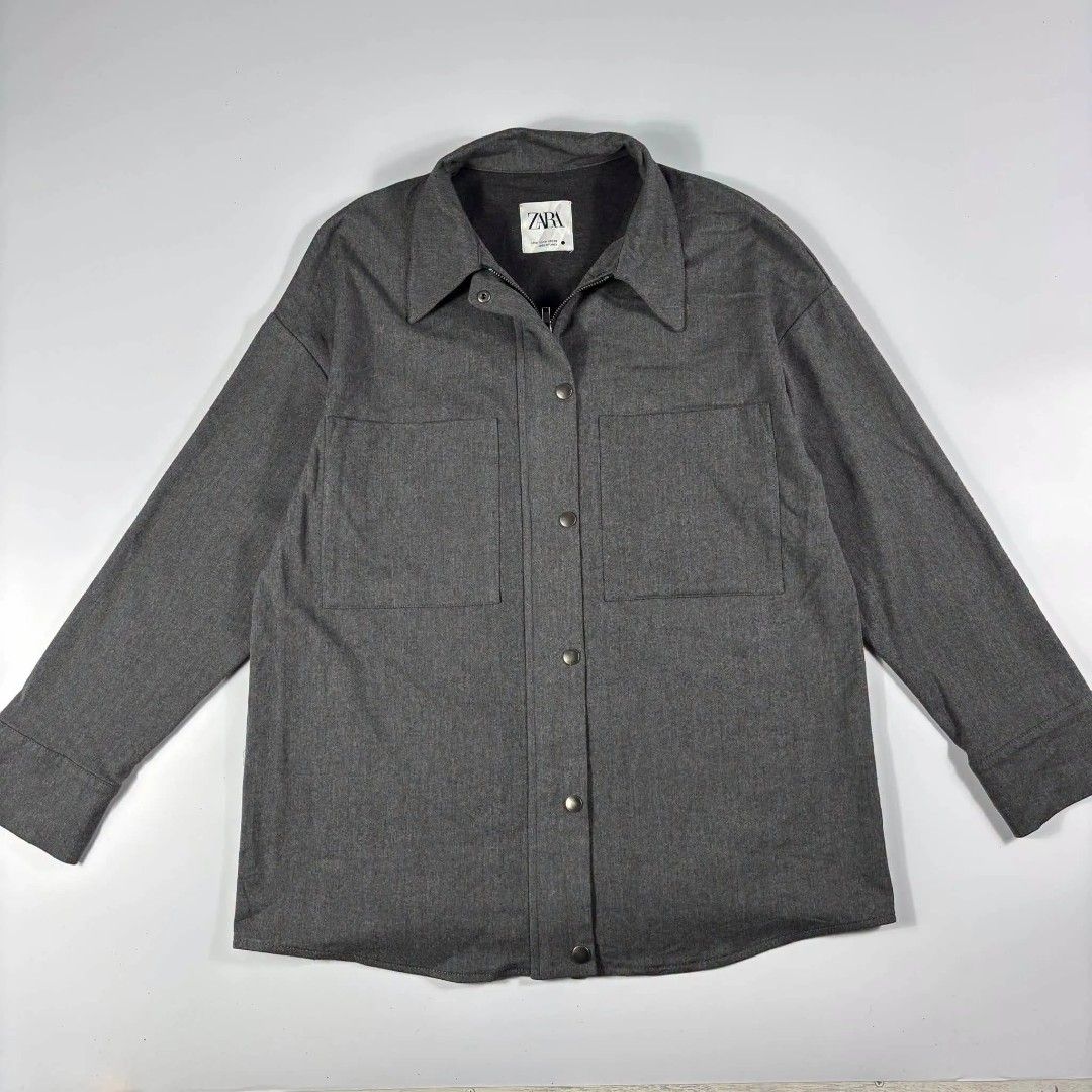 Zara Grey Overshirt Jacket Size M (Category: Formal Shirts) located in Manila. Submitted by kitkathrift (Listing ID 1465689198, Image 1). Description: - Brand/Model: Zara Overshirt - Color: Grey - Size: Medium (true to standard sizing) - Material: Heavy fabric texture - Closure: Full zip plus front snap buttons - Pockets: Two large chest pockets - Condition: Clean inside and out, great layering piece.