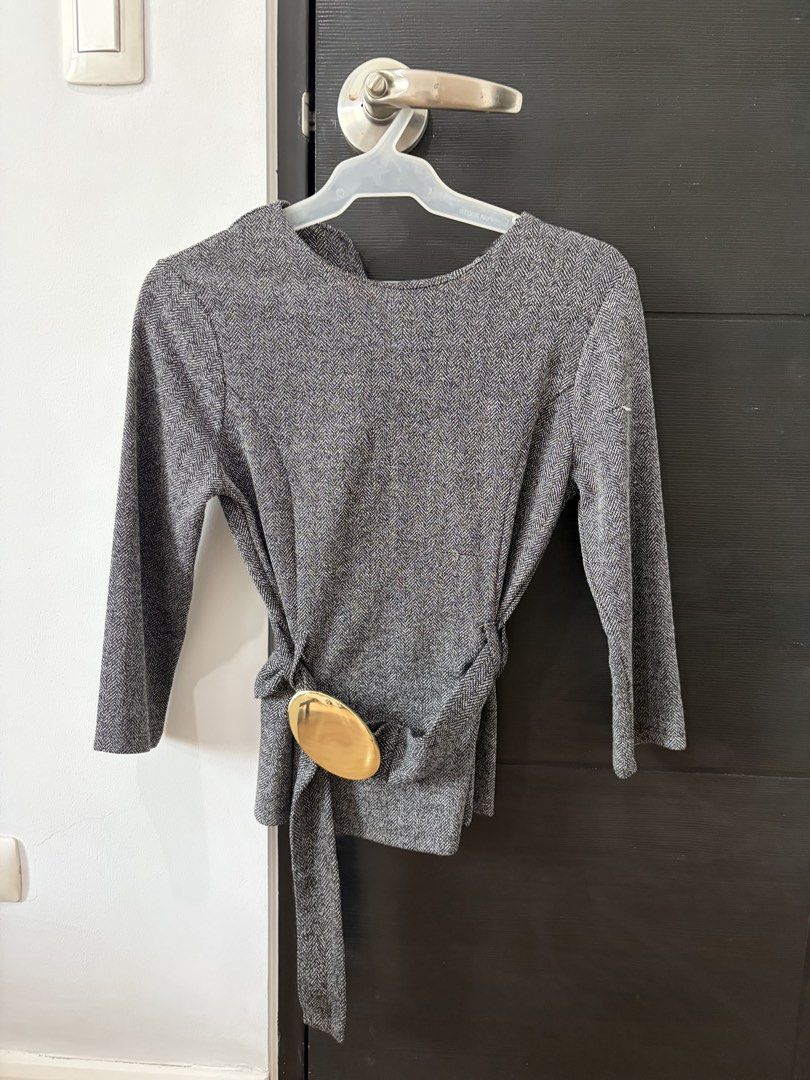 Zara Grey Top (Category: Blouses) located in Paranaque City. Submitted by mary_jj (Listing ID 1465654882, Image 1). Description: - Attached fabric belt with oval gold-tone buckle - Condition: Brand new, unworn with original store tags (Discounted price: 1,145 PHP) - Perfect for smart-casual or office wear.