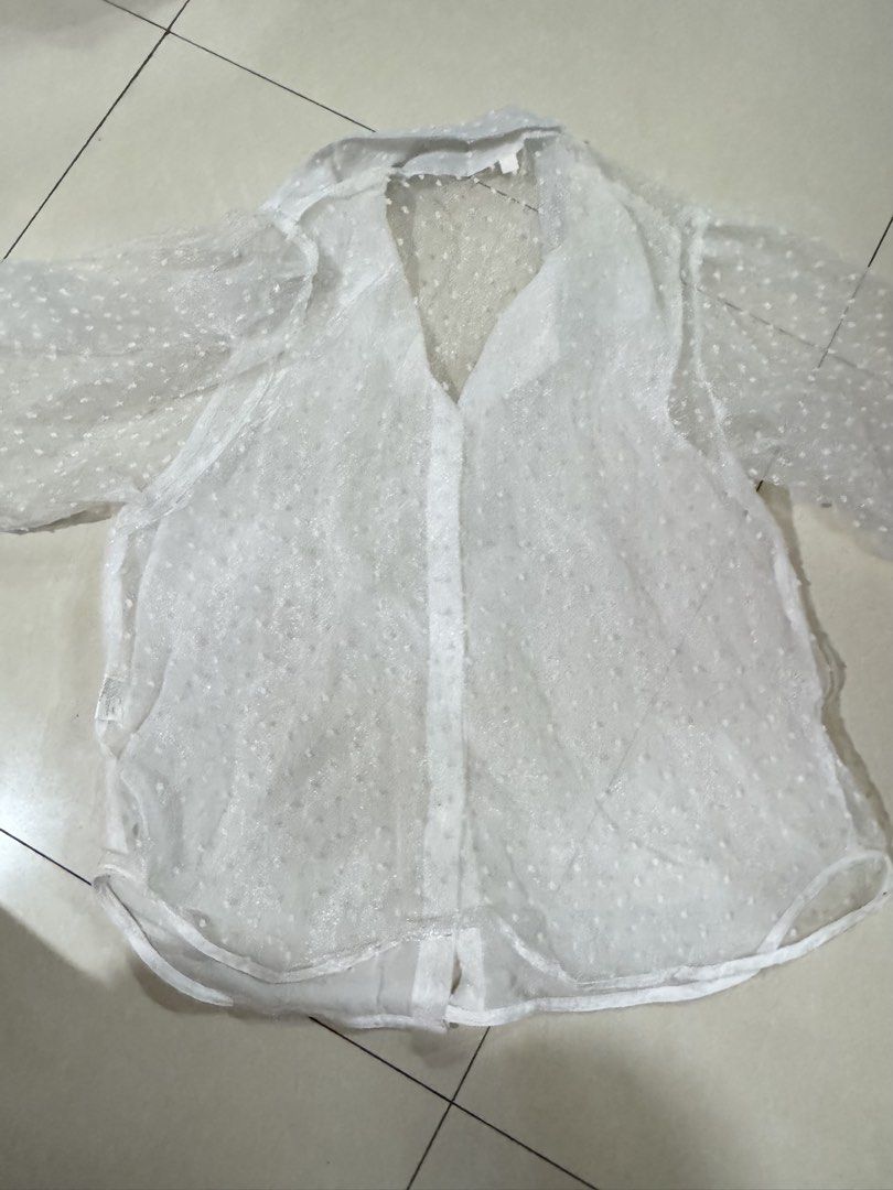 Zara inspired White Sheer Polka Dot Button-Up Blouse (Category: Blouses) located in Quezon City. Submitted by sweetlyluxe (Listing ID 1465624462, Image 3). Description: - Color: White - Size: S - Fabric: Lightweight with all-over dot texture - Design: Classic collar, long sleeves, button-down front - Styling: Perfect for layering over bralettes or camisoles.