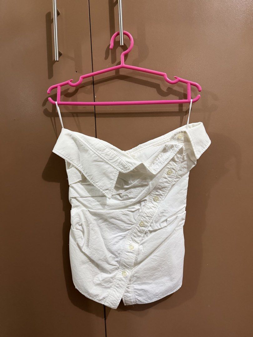 Zara Off-Shoulder Asymmetrical Button Top (Category: Blouses) located in Quezon City. Submitted by declutterbycy (Listing ID 1465758768, Image 1). Description: - Brand: Zara - Size: XS - Color: White - Material: Structured cotton-blend with ruching - Details: Off-shoulder, asymmetrical front button placket, folded collar - Origin: Made in Turkey - Condition: Clean, excellent, and ready to wear - Styling: Versatile piece that pairs easily with den