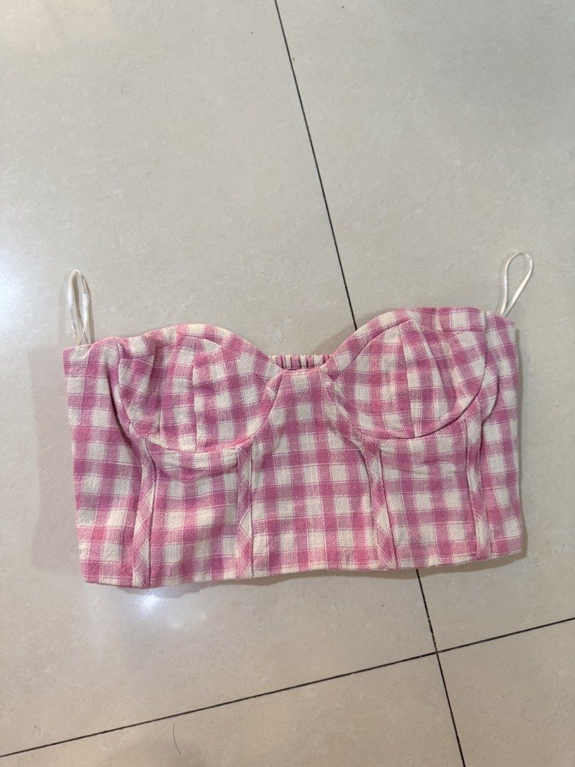 Zara Pink Gingham Plaid Bustier Crop Top (Category: Sleeveless) located in Quezon City. Submitted by sweetlyluxe (Listing ID 1465605534, Image 1). Description: - Brand: Zara - Size: S - Pattern: Pink and white gingham - Details: Sweetheart neckline with structured cups, stretchy smocked back panel, side zipper closure, and thin shoulder straps - Condition: Excellent, no flaws noticed - Vibe: Perfect for warm weather and casual outings - garden pa
