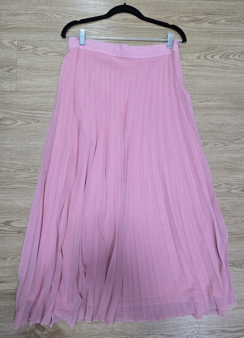 Zara pink pleated skirt (Category: Skirts) located in Quezon City. Submitted by jen_4kids (Listing ID 1465668278, Image 1). Description: Zara Pink pleated midi skirt Size L with zipper on one side With lining Measurements posted no pockets both side.
