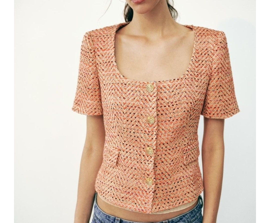 Zara Textured Tweed Crop Jacket Orange (Category: Coats, Jackets and Outerwear) located in Manila. Submitted by rcloset___ (Listing ID 1465632467, Image 1). Description: - Brand: Zara - Style: Textured tweed crop jacket with short sleeves and scoop neckline - Color: Vibrant orange with multicolor woven threads (hints of pink and purple) - Details: Gold-toned embossed front buttons, two front flap pockets, fully lined in white fabric - Condition: 