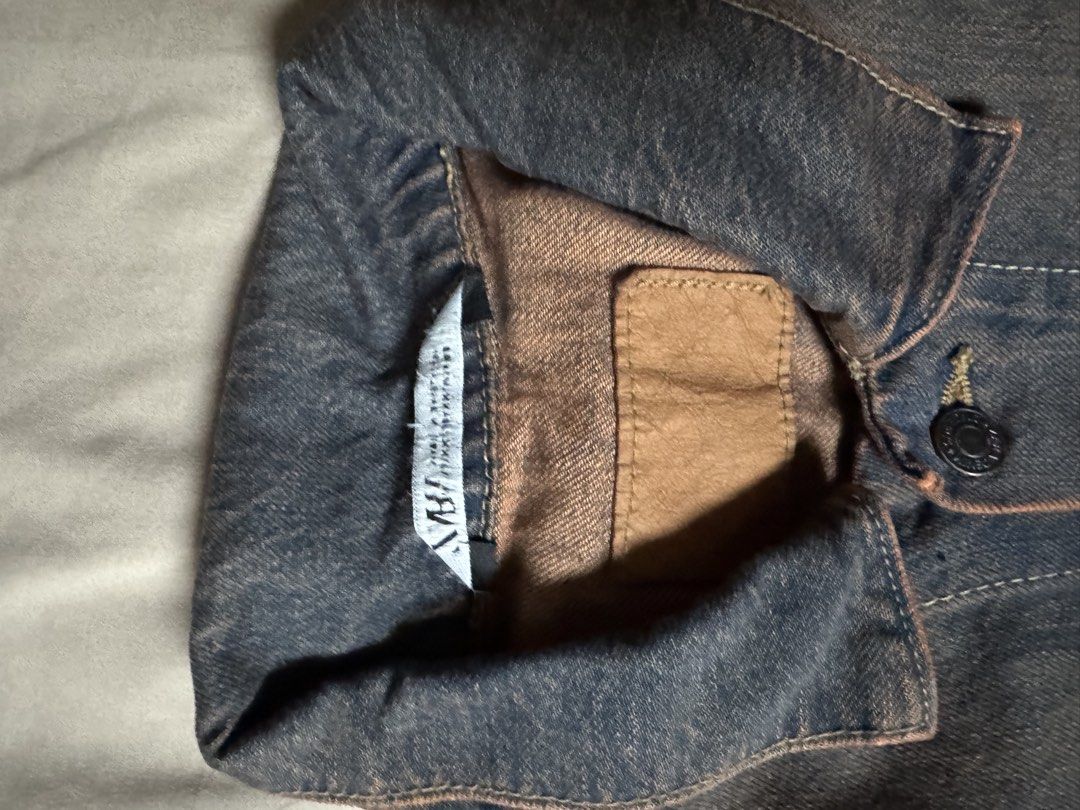 Zara Vintage Wash Denim Jacket (Category: Coats, Jackets and Outerwear) located in Manila. Submitted by seangoart (Listing ID 1465585042, Image 1). Description: - Brand: Zara - Style: Denim jacket in a unique dark wash with brown tint details - Design: Button-up front with structured collar and classic fit - Pockets: Convenient chest flap pockets and side welt pockets - Versatility: Great layering piece for cooler weather - Condition/Tag: Standar