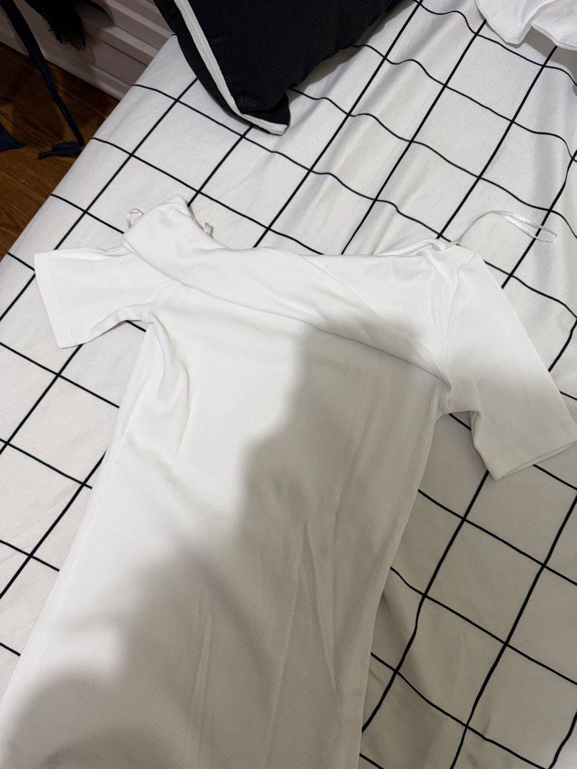 Zara White Ribbed Off-Shoulder Top (Category: Sleeveless) located in Quezon City. Submitted by declutterbycy (Listing ID 1465758607, Image 1). Description: - Brand: Zara - Style: Off-shoulder, short sleeves, slim fit - Material: Stretchy ribbed fabric - Size: S - Condition: Neat and clean.