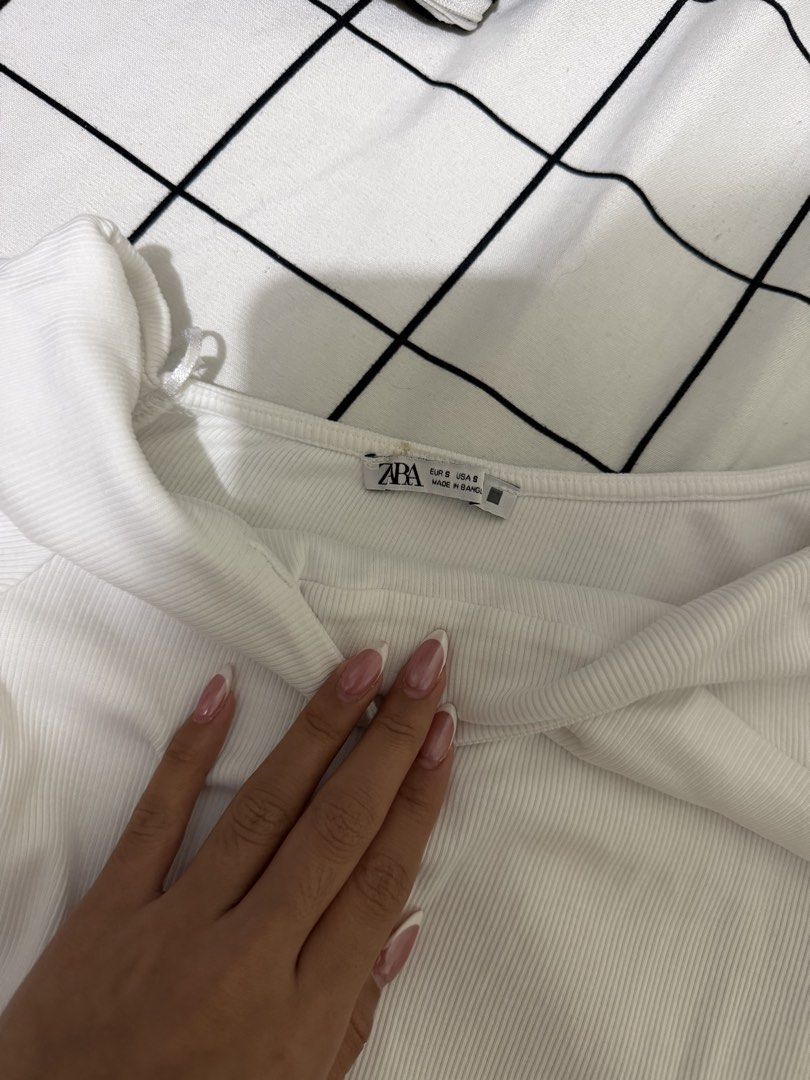 Zara White Ribbed Off-Shoulder Top (Category: Sleeveless) located in Quezon City. Submitted by declutterbycy (Listing ID 1465758607, Image 2). Description: - Brand: Zara - Style: Off-shoulder, short sleeves, slim fit - Material: Stretchy ribbed fabric - Size: S - Condition: Neat and clean.
