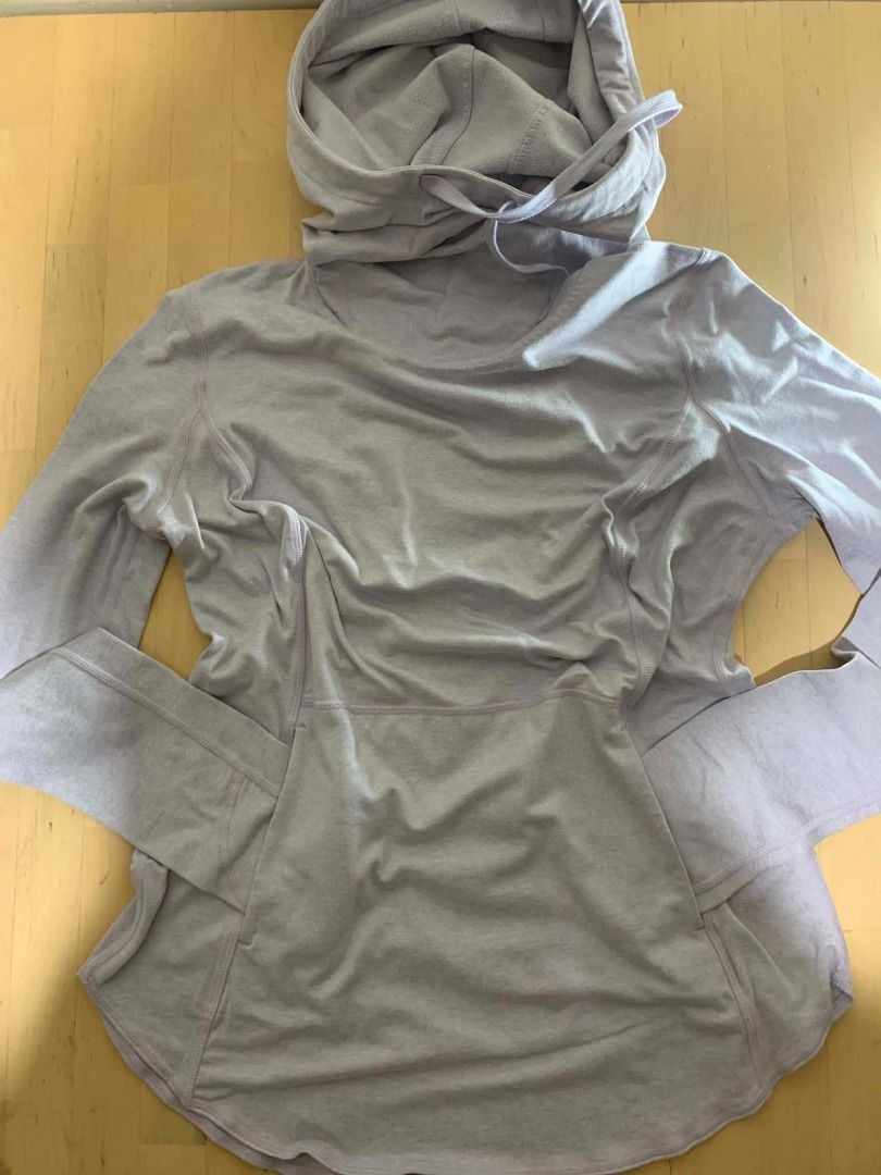 Zella Lavender Heathered Pullover Hoodie Sweatshirt Size Small (Category: Coats, Jackets and Outerwear) located in Manila. Submitted by musedeclutters (Listing ID 1465643386, Image 1). Description: - Brand: Zella - Size: Small (S) - Color: Soft lavender heather - Material/Interior: Cozy fleece texture - Design: Crossover collar, adjustable drawstring hood, long sleeves - Features: Front kangaroo pocket, curved hem, small metallic logo charm - Con