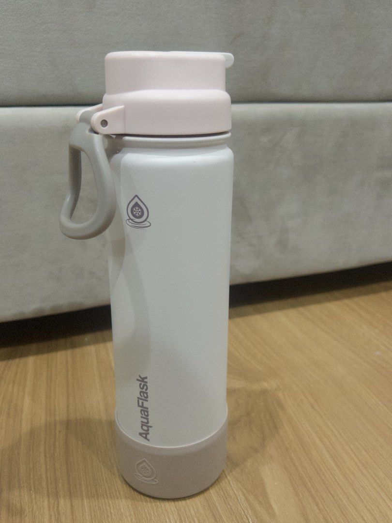 22 Oz. Vanilla Spiced AquaFlask Water Bottle (Category: Water Bottles & Tumblers) located in Manila. Submitted by extras_bym (Listing ID 1471244344, Image 1). Description: - Brand: AquaFlask - Color: White with soft pink lid and matching silicone boot - Condition: Good, with a minor scuff spot on the spout cover - Features: Double-wall insulation keeps drinks cold all day - Best for: School, gym, office, or daily use - PM for fast shipping and in