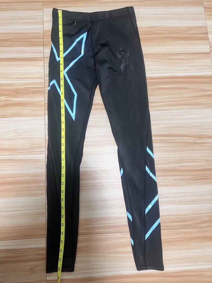 2XU Womens Compression Leggings Black Blue Size L (Category: Activewear) located in Manila. Submitted by jk2578 (Listing ID 1471136514, Image 3). Description: - Brand: 2XU - Item: Women's compression leggings - Color: Black with blue signature X branding - Size: L (Waist: ~13 inches across, Length: ~34 inches down the side) - Features: Inner drawstring closure for a secure fit - Origin: Made in Thailand - Condition: Excellent quality, perfect for