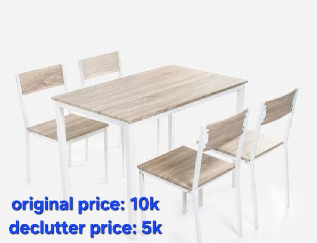 4 seater dining table (Category: Tables & Sets) located in Manila. Submitted by chummynogs (Listing ID 1471282372, Image 1). Description: - Set includes: 1 dining table and 4 matching chairs - Design: Modern light wood grain finish with sturdy white metal frames - Perfect for: Small apartments, condo units, and cozy kitchen spaces - Maintenance: Easy to wipe clean - Reason for selling: House move.
