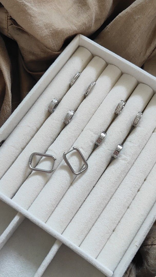 (80 each pair )Silver Hoop Earrings Various Designs (Category: Earrings) located in Quezon City. Submitted by thestargazerspica (Listing ID 1471207891, Image 3). Description: -80 pesos each - Non Tarnish rhinestone-encrusted, geometric, and rectangular designs - Features secure clasp closures on all pieces.