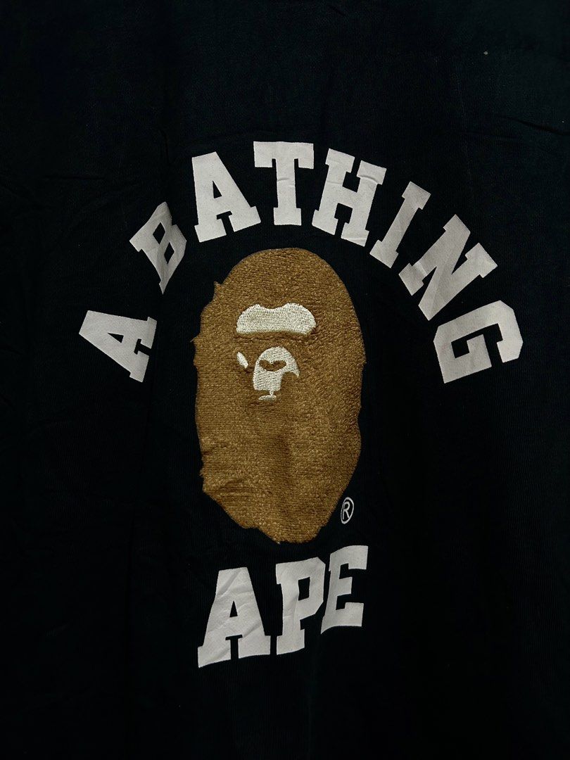 A Bathing Ape BAPE Arch Logo Black Sweatshirt (Category: Coats, Jackets and Outerwear) located in Calbayog City. Submitted by thrift.bucks101 (Listing ID 1471236713, Image 2). Description: - Brand: A Bathing Ape (BAPE) by Nowhere Co., Ltd. - Color: Black - Size: XXL - Material: 100% premium cotton - Design: Large chenille ape head graphic with printed arch lettering - Details: Classic ape head sleeve tag on left cuff - Condition: Clean, worn a fe